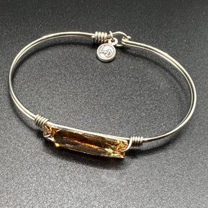 Sterling silver wire bracelet with topaz colored gemstone